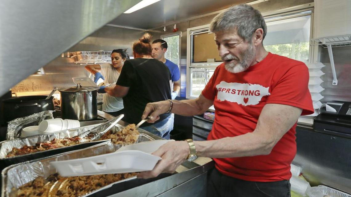 Joseph Badame of Medford, N.J., helps during a food truck fundraiser for the people of Puerto Rico in the aftermath of Hurricane Maria at Anthony Barber and Victoria Martinez-Barber’s home, Friday, Sept. 29, 2017, in Medford, N.J. Badame donated 80 barrels of food weighing 360 pounds each to hurricane victims.