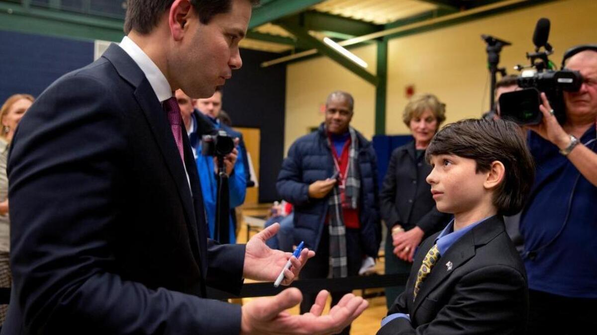 Peter Reid, 11, of Epsom, N.H., asks Republican presidential candidate Sen. Marco Rubio, R-Fla., a question about the Islamic State group and his foreign policy ideas after attending the final rally before the New Hampshire primary at Nashua Community College in Nashua, N.H., Monday Feb. 8, 2016. "Would you like to be my Secretary of State?" joked Rubio after talking to Reid.