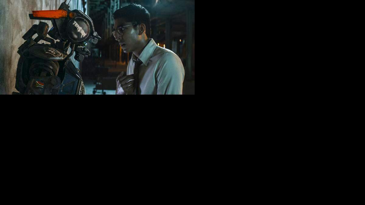 
Chappie and his maker (Dev Patel) in Columbia Pictures' action-adventure film "Chappie." 
