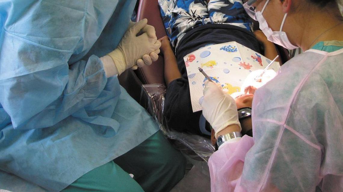 The Justice Department is requiring Kool Smiles dental clinics to pay $23.9 million for unneeded root canals and other procedures billed to Medicaid.