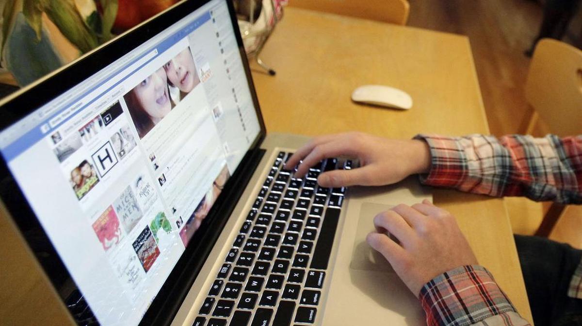 A student works on a computer. 