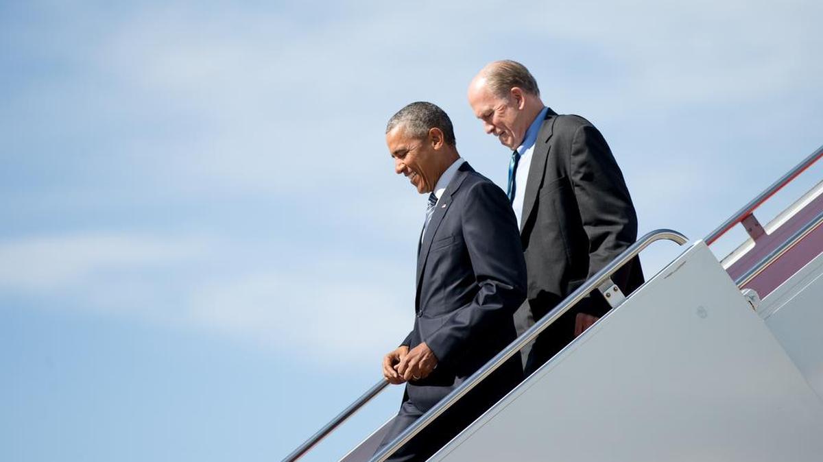 
President Barack Obama, accompanied by Alaska Gov. Bill Walker, steps off Air Force One after arriving at Elmendorf Air Force Base on Monday in Anchorage, Alaska.
