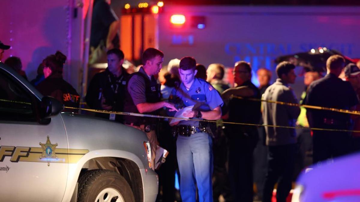 Law enforcement officers work at the crime scene outside of Cascade Mall in Burlington, Wash., where several people were fatally shot on Friday, Sept. 23, 2016. Authorities in Washington State say several people have been killed during a shooting at the mall north of Seattle and that at least one suspect remains at large. Sgt. Mark Francis says authorities are searching for a man wearing gray who was last seen walking toward Interstate 5 from the mall.