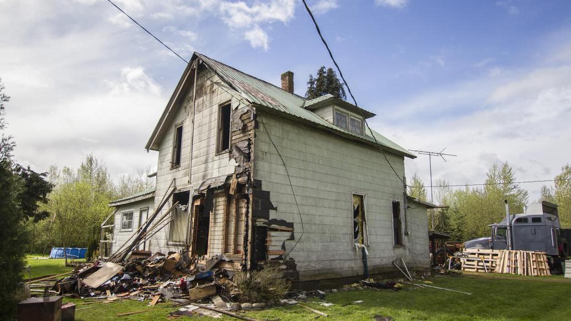 The house in Everson, Wash., is heavily damaged after a fire April 3. Randy Velthuizen, the home’s occupant, was using a blowtorch to get rid of weeds in a flowerbed shortly before the fire started.