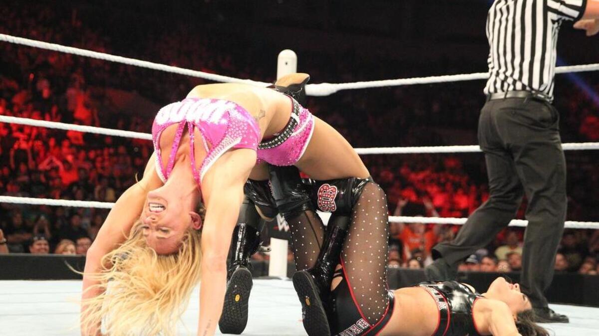 Ashley Fliehr, or Charlotte, now has her own action figure, appears on the upcoming cover of “Muscle & Fitness” magazine, and young fans post photos of themselves trying the “bridge” from her Figure 8 (her version of her dad’s famous finisher the Figure Four) on opppnent, Paige.
