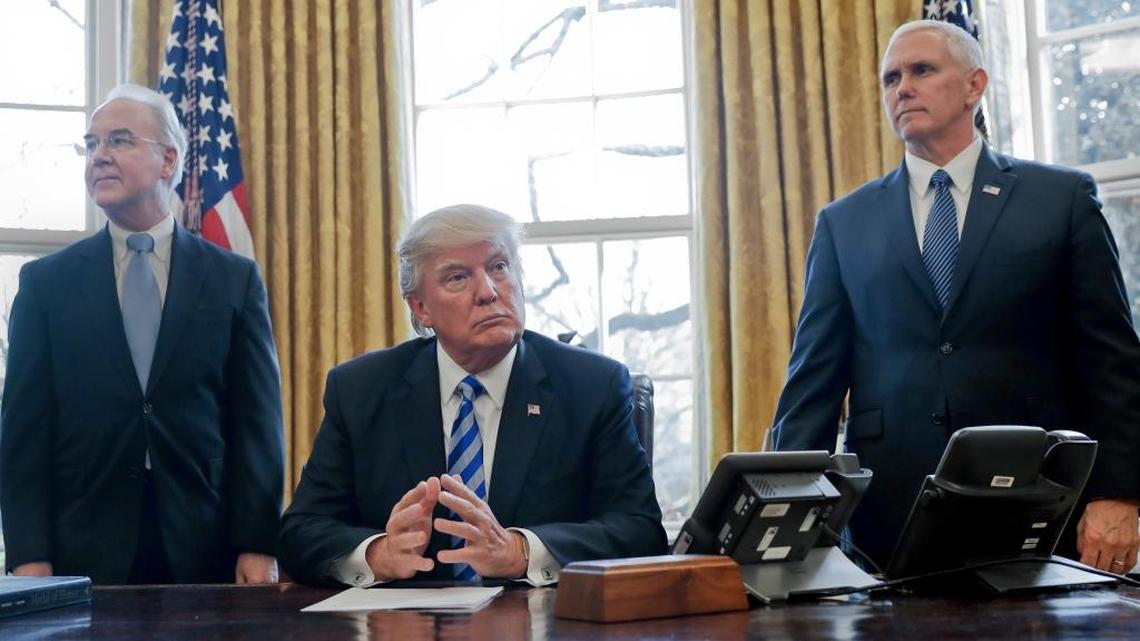 President Donald Trump, flanked by Health and Human Services Secretary Tom Price, left, and Vice President Mike Pence, right, before addressing members of the media regarding the health care overhaul bill, Friday, March 24, 2017, in the Oval Office of the White House in Washington.
