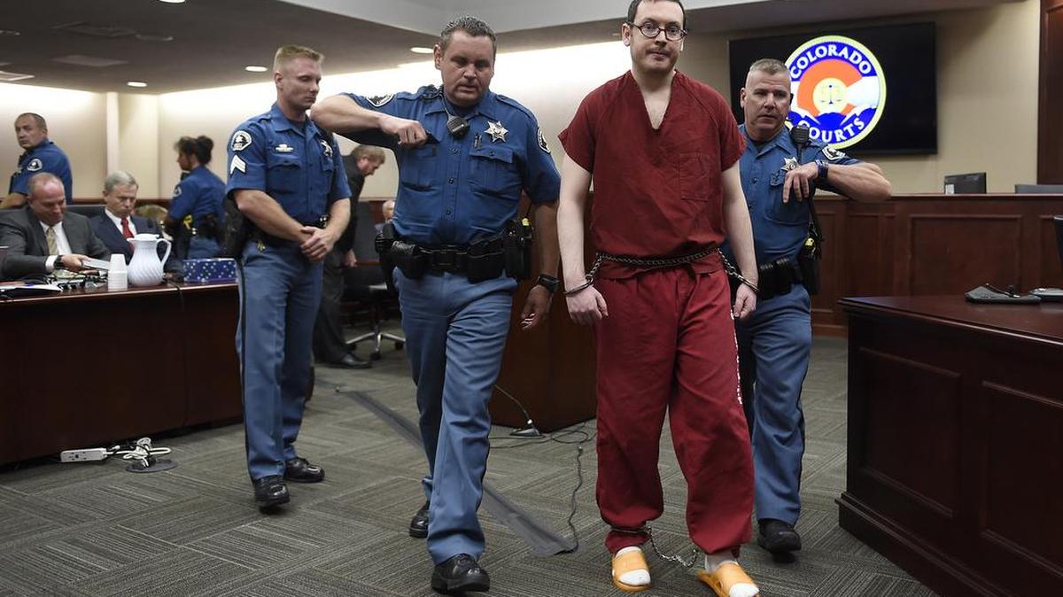James Holmes is led out of the courtroom after being formally sentenced for the Aurora movie theater shooting in Centennial, Colo., on Aug. 26. The judge issued 12 life sentences in prison to Holmes, who fatally shot 12 people in a movie theater three years ago and wounded 70 others. On Wednesday, authorities announced Holmes had been moved to an undisclosed prison, possibly out of state. It was his third transfer in five months.