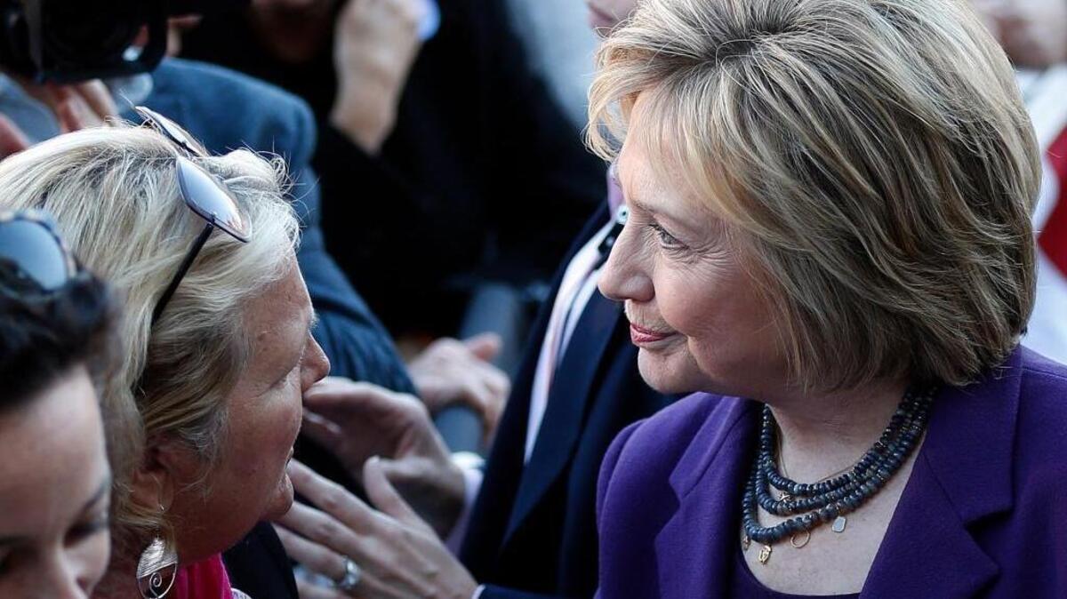 Democratic presidential candidate Hillary Rodham Clinton greets supporters after filing papers to be on the Nation's earliest presidential primary ballot at The Secretary of State's office Monday, Nov. 9, 2015, in Concord, N.H.