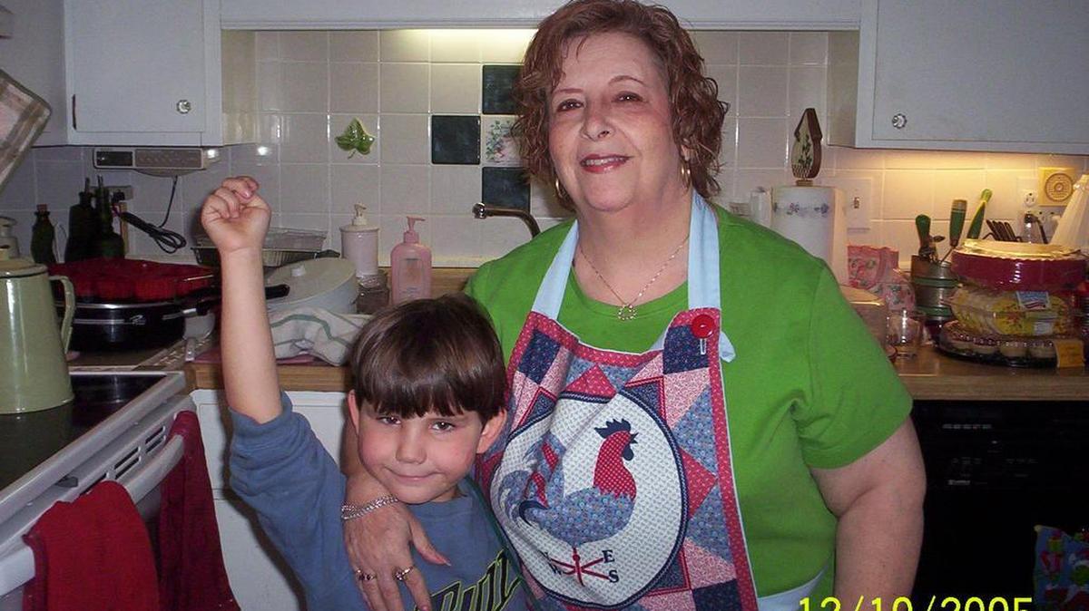 Barbara Barkley with her grandson, making Christmas cookies at the house she lost to a mortgage scam. Barkley is 4 feet 10 inches tall. So she designed her home in Chesapeake, Va., just for herself, with all the counters and handles lowered.