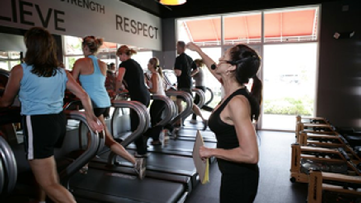 Ellen Latham at Orange Theory conducting a fat-burning class