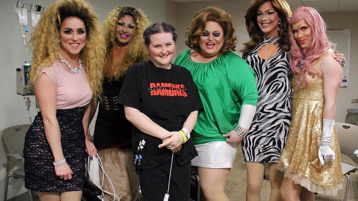 Kyla Rose Robbins, 18, (third from left) poses with hospital visitors (from left) Jayden Starr of Raleigh, Devon Mitchell of Charlotte, Matt Ramsey of Charlotte, Justin Natvig of Carrboro, and Adam Ward of Raleigh at the Duke Medicine Pavilion on Thursday. Robbins needs a heart transplant and had asked on social media for drag queens to come cheer her up.