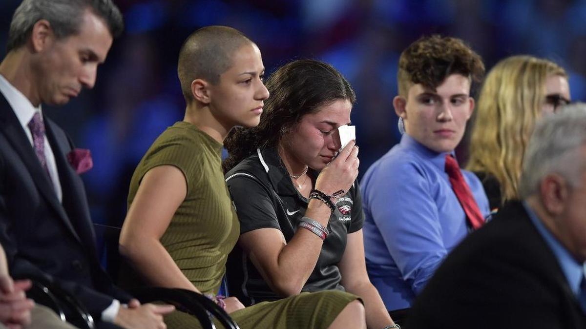 Marjory Stoneman Douglas High School student Emma Gonzalez comforts a classmate during a CNN town hall meeting on Wednesday at the BB&T Center in Sunrise.