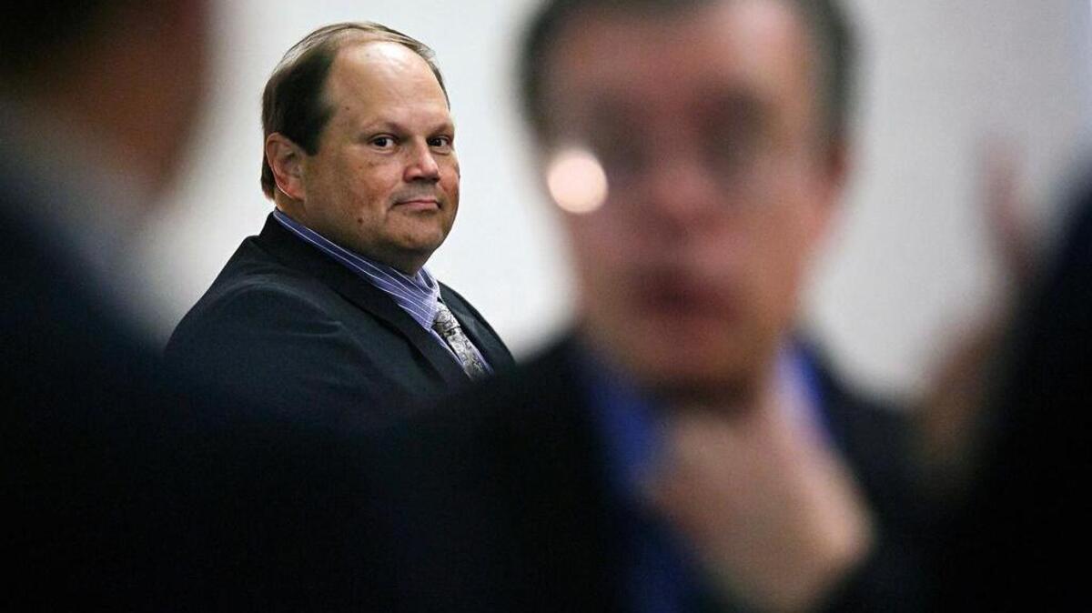 Eddie Tipton looks over at his lawyers before the start of his trial in Des Moines, Iowa, in July. The former security director of the Multi-State Lottery Association, accused of tampering with lottery drawings to rig jackpots in four states, was convicted of fraud in the attempt to claim a $16.5 million jackpot in Iowa. Investigators are now looking at payouts in 37 other states and U.S. territories that used random-number generators from the Iowa-based association, which administers games and distributes prizes for the lottery consortium.