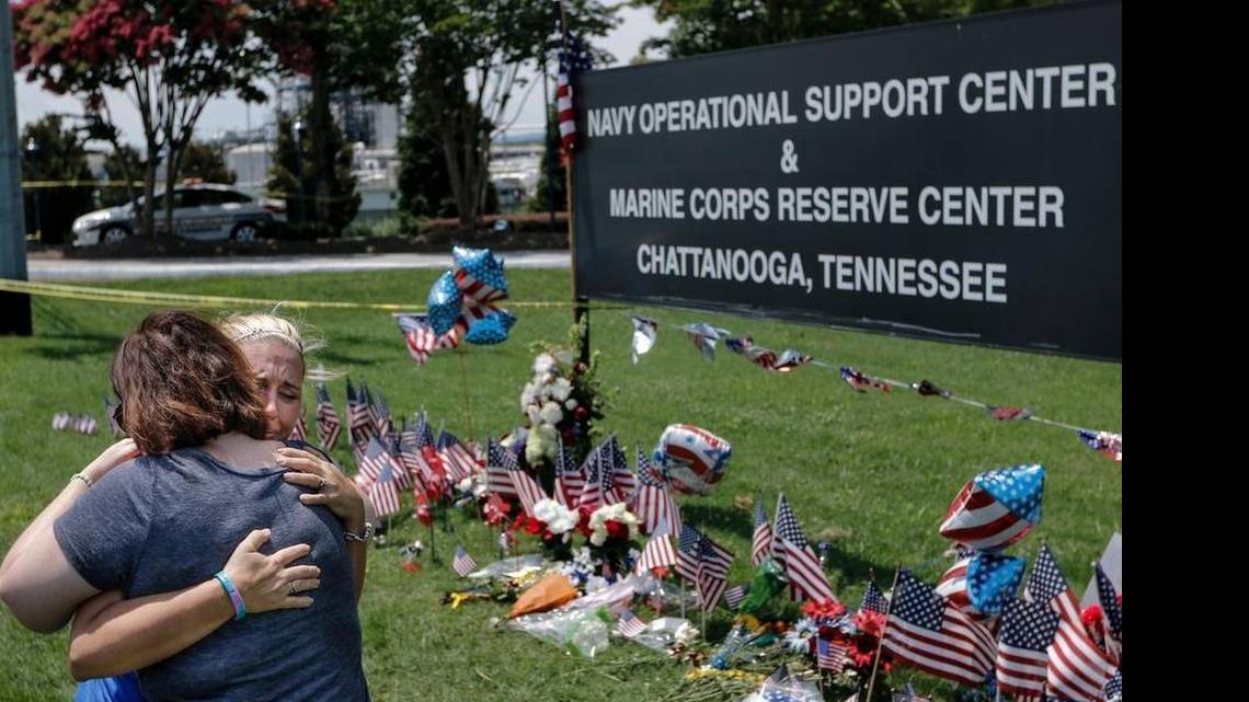 
Mourners embrace at a makeshift memorial at the Navy Operational Support Center and Marine Corps Reserve Center in Chattanooga, Tenn., where five service members were fatally shot.
