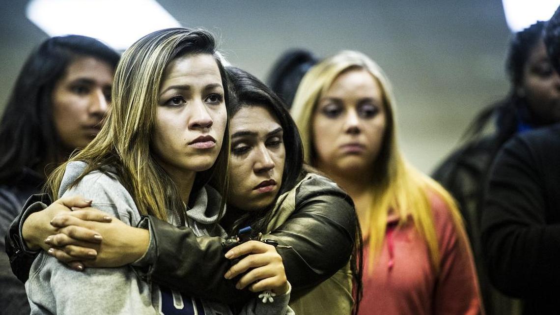 Maria Higareda-Marquez, 20, of Merced hugs fellow UC Merced junior Vanessa Dias of Tracy on Wednesday during a gathering at Vault Works in downtown Merced. Students held the gathering in a show of support for one another after the stabbing attack earlier in the day.