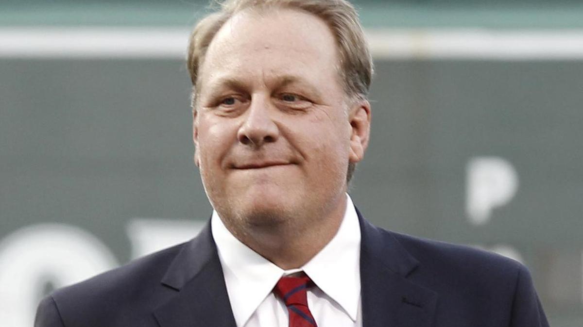 Former Boston Red Sox pitcher Curt Schilling looks on after being introduced as a new member of the Boston Red Sox Hall of Fame in 2012. Schilling has been fired by ESPN after making comments on social media about transgender people.