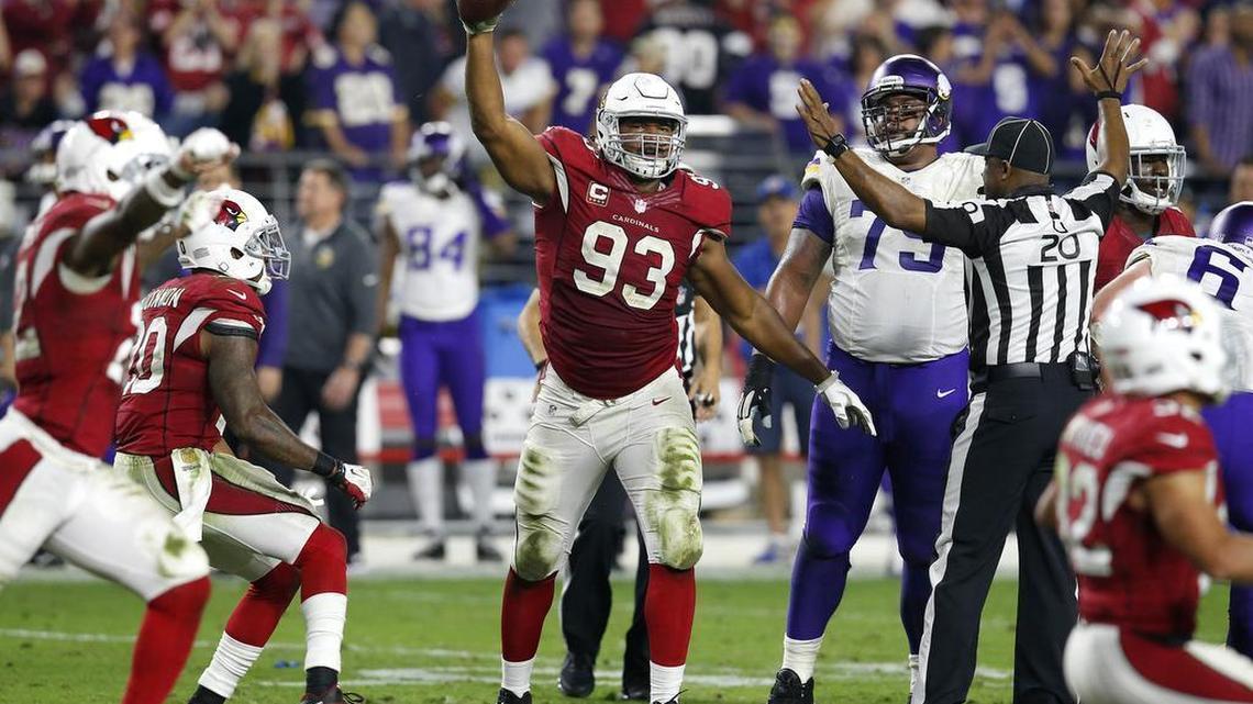 Arizona Cardinals defensive end Calais Campbell (93) holds up the football after a fumble recovery for the win against the Minnesota Vikings during the second half of an NFL football game, Thursday, Dec. 10, 2015, in Glendale, Ariz. The Cardinals won 23-20.