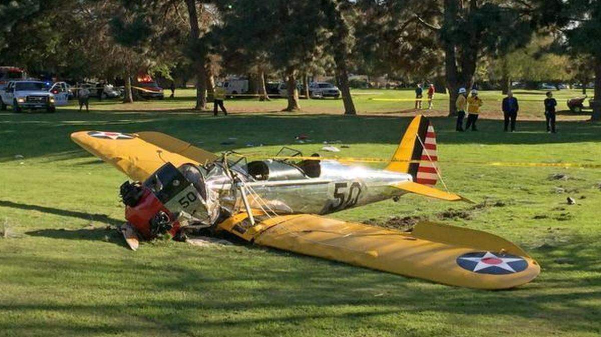 
A small plane lies where it crash-landed on Penmar Golf Course in the Venice area of Los Angeles on Thursday, March 5, 2015. The course is near the Santa Monica, Calif. Municipal Airport, just west of a runway, but there was no immediate confirmation on whether the plane had taken off or was trying to land. 
