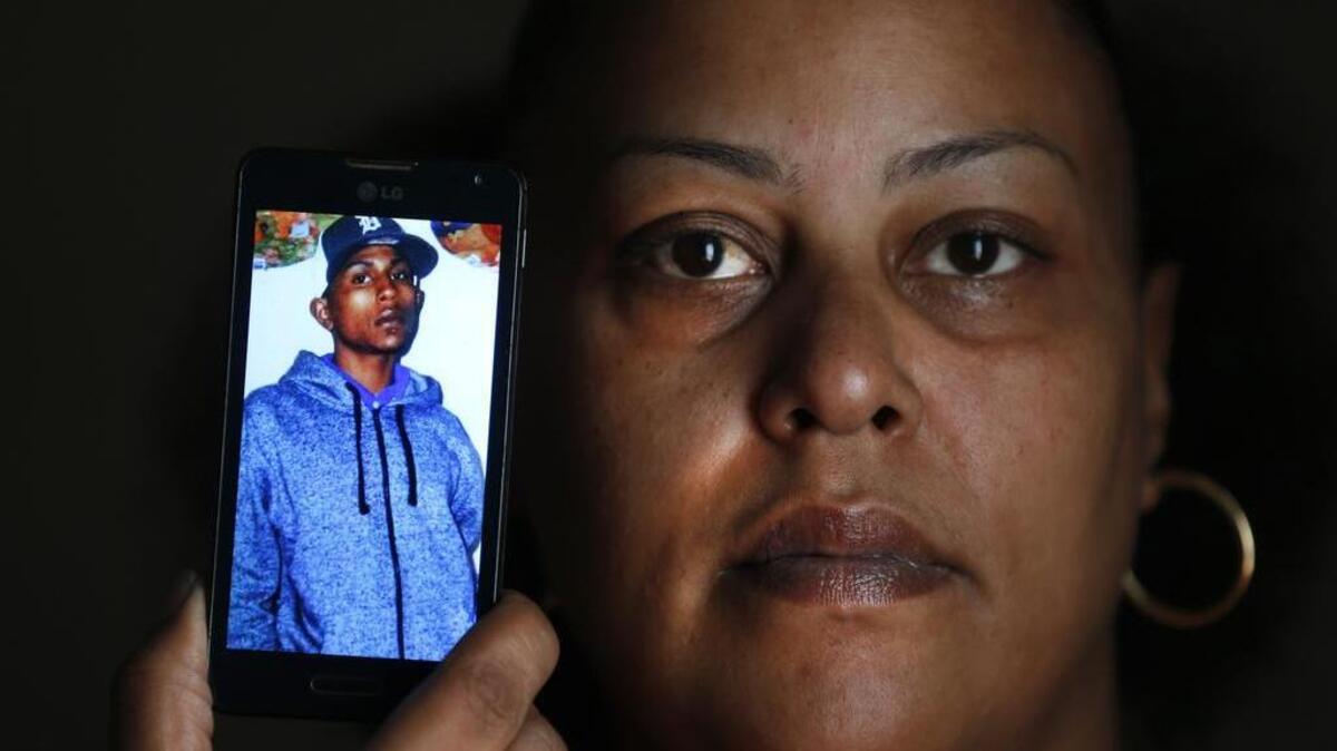 Rebecca O’Hara holds a phone showing a photo of her 25-year-old transgender son Ashton O’Hara in Detroit on Wednesday, Nov. 11, 2015. Ashton O’Hara, whose body was found in a field with stab wounds, was killed in July 2015. While Caitlyn Jenner made the cover of Vanity Fair and Laverne Cox prospered as a popular actress, other transgender women have become homicide victims at an alarming rate.