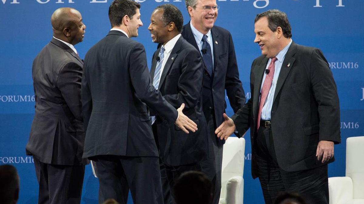 Republican presidential candidates Ben Carson, center, Jeb Bush and New Jersey Gov. Chris Christie, right, shake hands with Sen. Tim Scott, R-S.C., left, and House Speaker Paul Ryan of Wis. at an economic forum in Columbia, S.C. The candidates said their party must do more to convince poor Americans that conservative policies and not an active federal government, will expand economic opportunity.