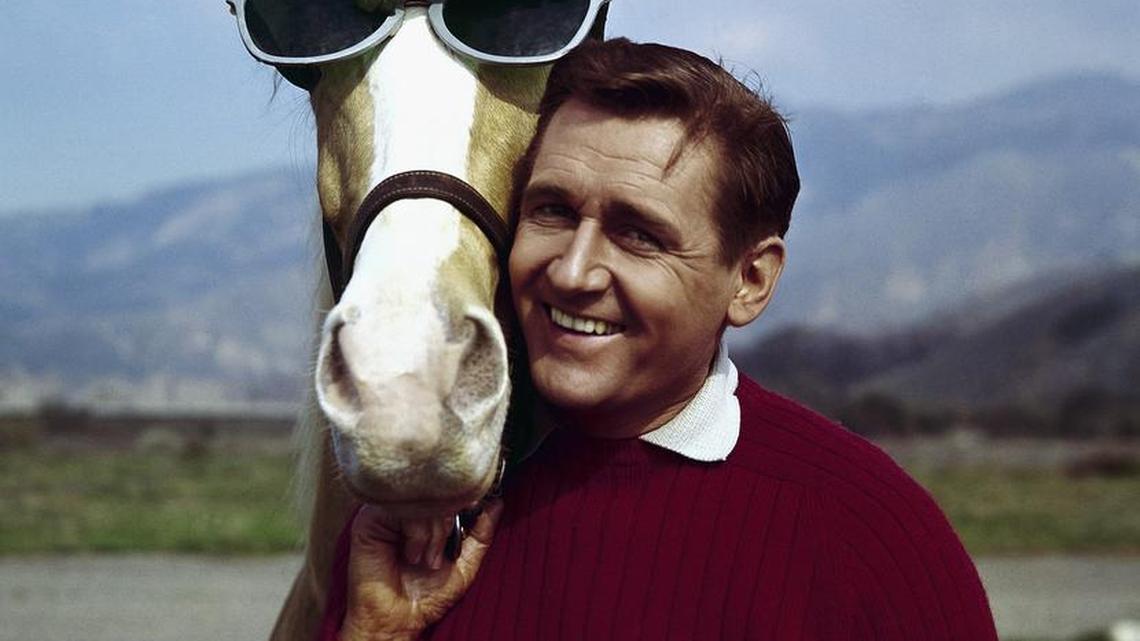 In this March 22, 1962 photo, actor Alan Young poses with the "Mister Ed" horse. Young died Thursday, May 19, 2016. He was 96.