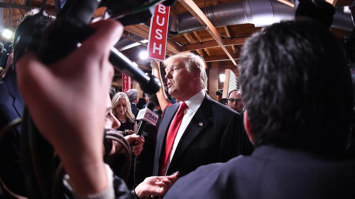 Republican presidential candidate, businessman Donald Trump speaks to the media in the spin room after the CBS News Republican presidential debate at the Peace Center Saturday night.