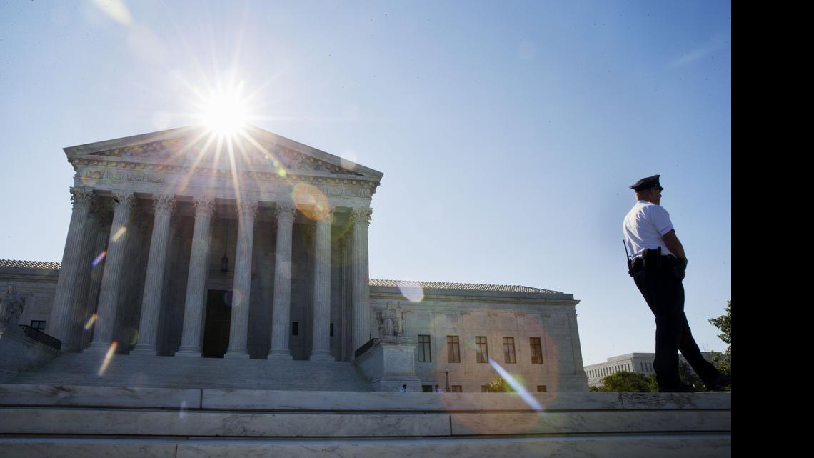 
Security patrols outside of the Supreme Court in Washington, Monday June 29, 2015. 
