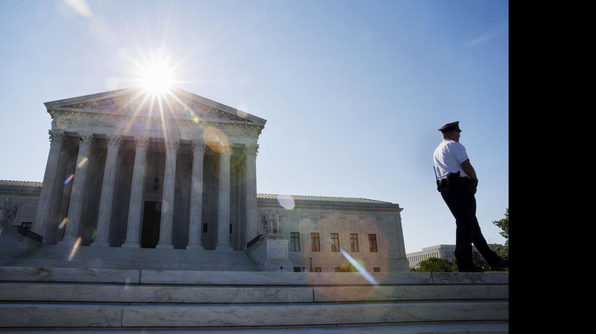 
Security patrols outside of the Supreme Court in Washington, Monday June 29, 2015. 
