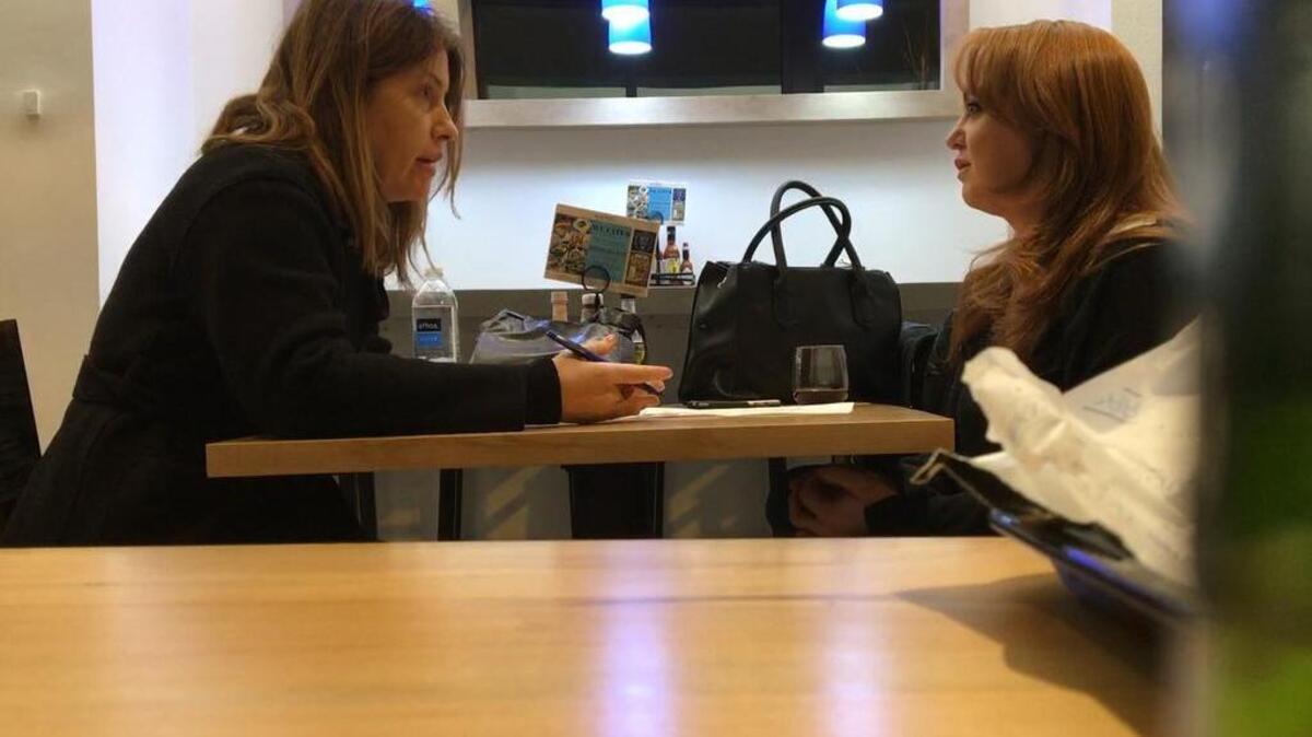 Washington Post reporter Stephanie McCrummen, left, interviews Jaime T. Phillips at a Greek restaurant in Alexandria, Va., on Wednesday.