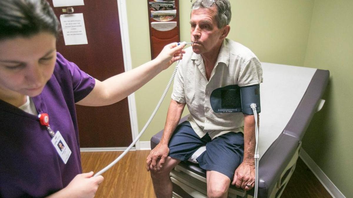 Terry Brewster, a construction worker in his mid-50s who has marketplace health insurance, visits Dr. Paul Cohen at the Little River Medical Center in Little River, S.C., in June 2015. Brewster would receive less financial assistance with his insurance premiums and face higher charges under the GOP plan to repeal the Affordable Care Act.