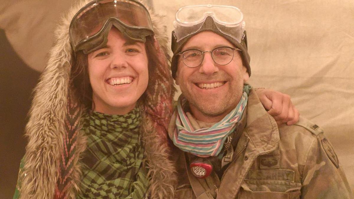 Rev. Brian Baker and his 23-year daughter Laura Baker, wearing goggles for dust storms, at Burning Man in 2015.