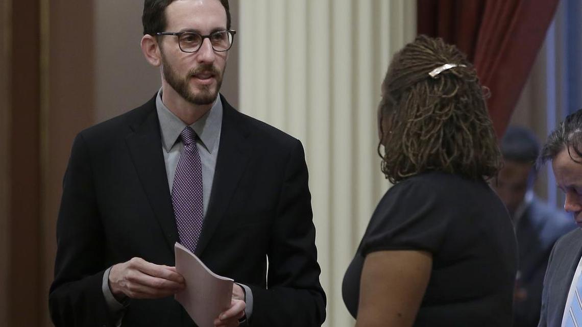 State Sen. Scott Wiener, D-San Francisco, left, talks with Sen. Holly Mitchell, D-Los Angeles, at the Capitol, Thursday, Jan. 26, 2017, in Sacramento, Calif. Wiener, and Sen. Toni Atkins, D-San Diego, introduced legislation on Thursday to add a non-binary gender option on state identifying documents including driver's licenses, birth certificates and identity cards.