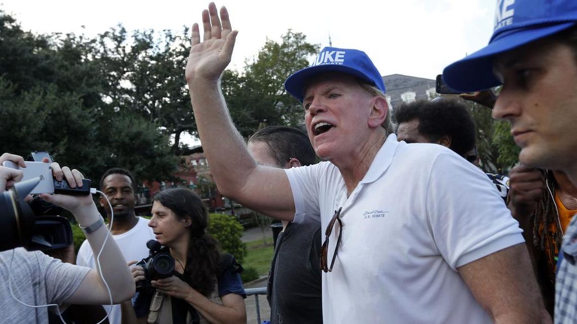 Former Ku Klux Klan leader and current U.S. Senate candidate David Duke, with a group of supporters, speaks in front of a statue of Andrew Jackson, in Jackson Square, prior to a protest organized by Take Em Down NOLA, who want statues of Confederate figures to be taken down, in New Orleans, Saturday, Sept. 24, 2016. Duke defends the heritage of the statues.