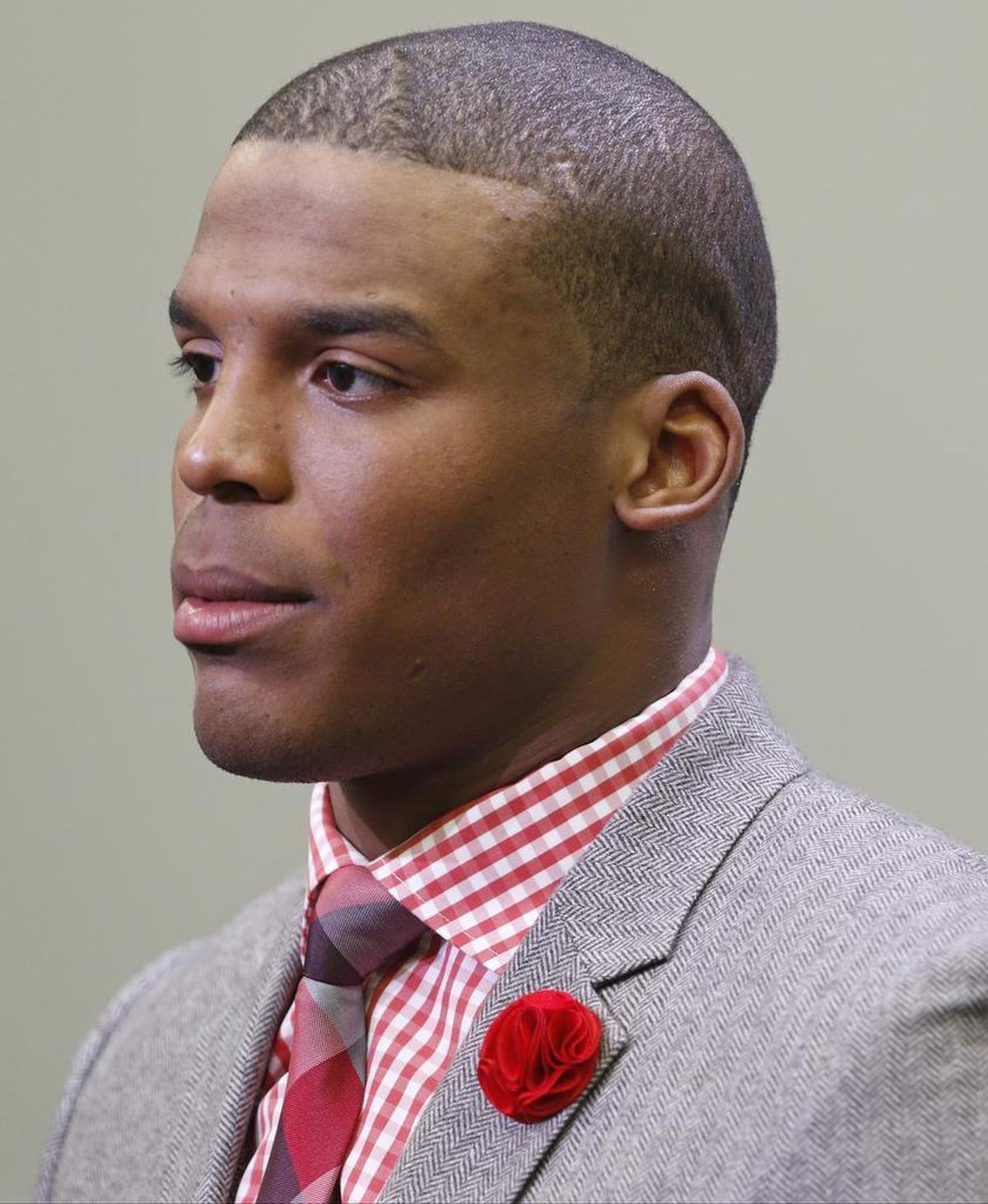 Carolina Panthers’ Cam Newton speaks to the media after an NFL football game against the Cleveland Browns in Charlotte, N.C., Sunday, Dec. 21, 2014.