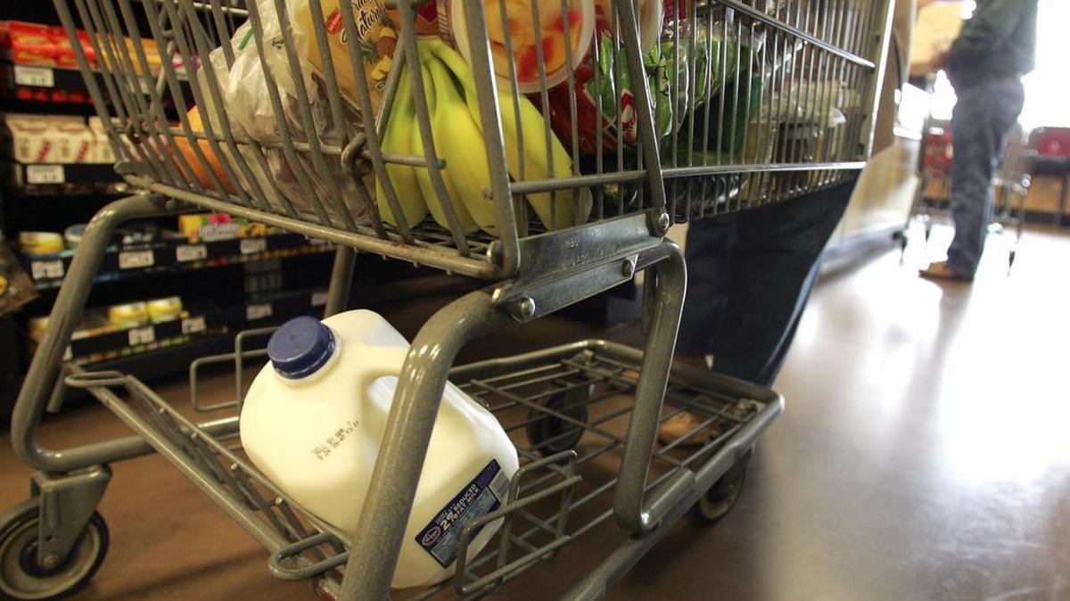 In this photo made Tuesday, March 24, 2009, a cart full of a groceries is seen at the check-out counter at a Kroger store in Gahanna, Ohio.