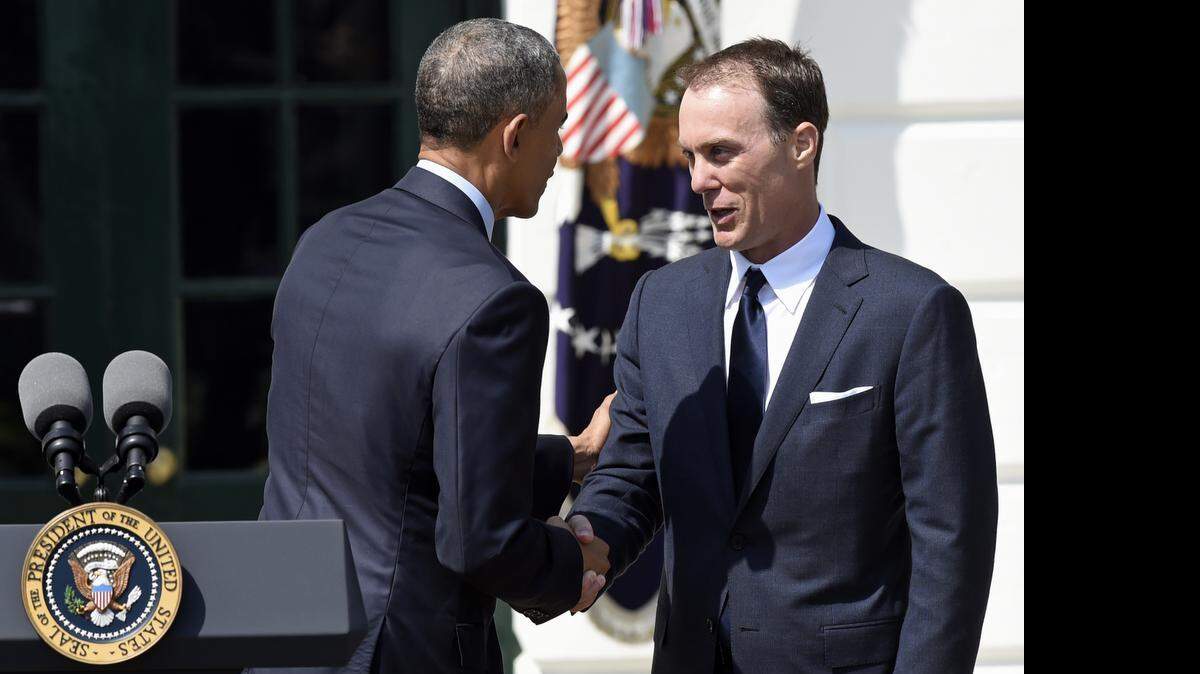 
President Barack Obama shakes hands with NASCAR 2014 Sprint Cup Series champ Kevin Harvick during an event on the South Lawn of the White House in Washington honoring Harvick and his 2014 championship. 
