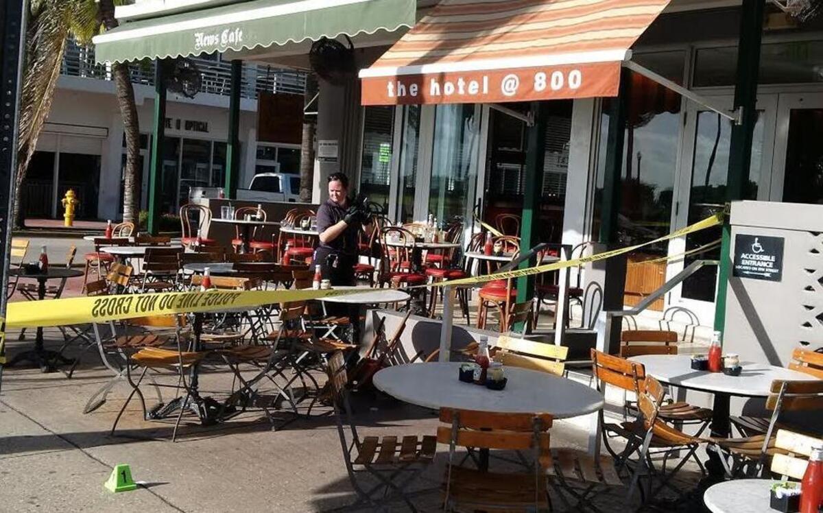 A police cone representing a bullet was placed under a table at Eighth Street and Ocean Drive at the News Cafe.