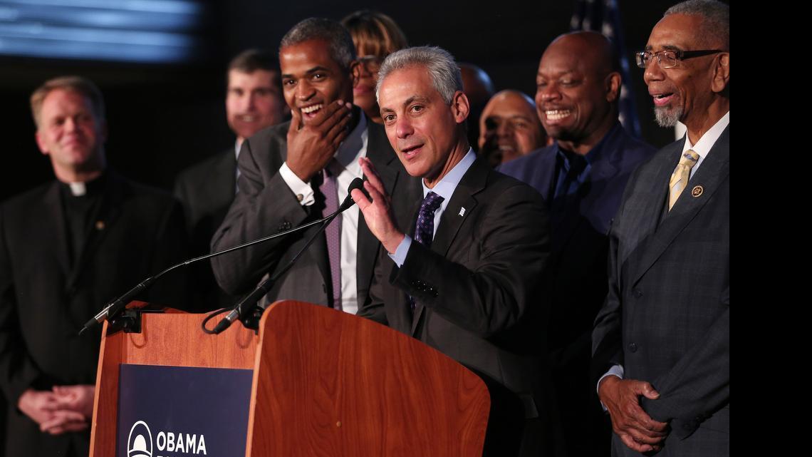 
Chicago Mayor Rahm Emanuel laughs along with Martin Nesbitt, left, chairman of the Barack Obama Foundation, as they announce that the city will be the future home of the Obama presidential library on Tuesday, May 12, 2015, during a press conference at the Gary Comer Youth Center in Chicago. 
