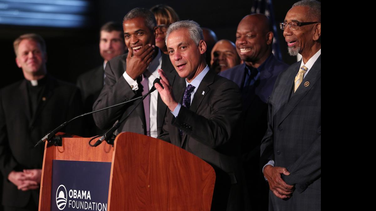 
Chicago Mayor Rahm Emanuel laughs along with Martin Nesbitt, left, chairman of the Barack Obama Foundation, as they announce that the city will be the future home of the Obama presidential library on Tuesday, May 12, 2015, during a press conference at the Gary Comer Youth Center in Chicago. 
