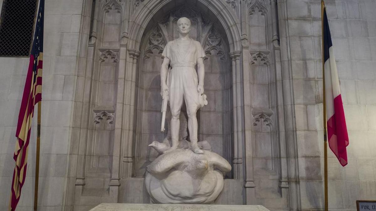 A statue in his tomb depicts Norman Prince astride an eagle.