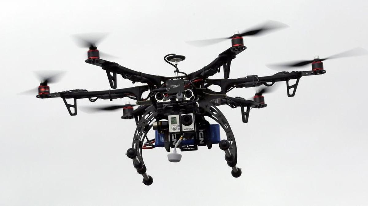 A drone is demonstrated in Brigham City, Utah, in 2014. The Federal Aviation Administration announced Monday that owners of many small drones and model airplanes will have to register them with the government, in response to increasing reports of drones flying near manned aircraft and airports.