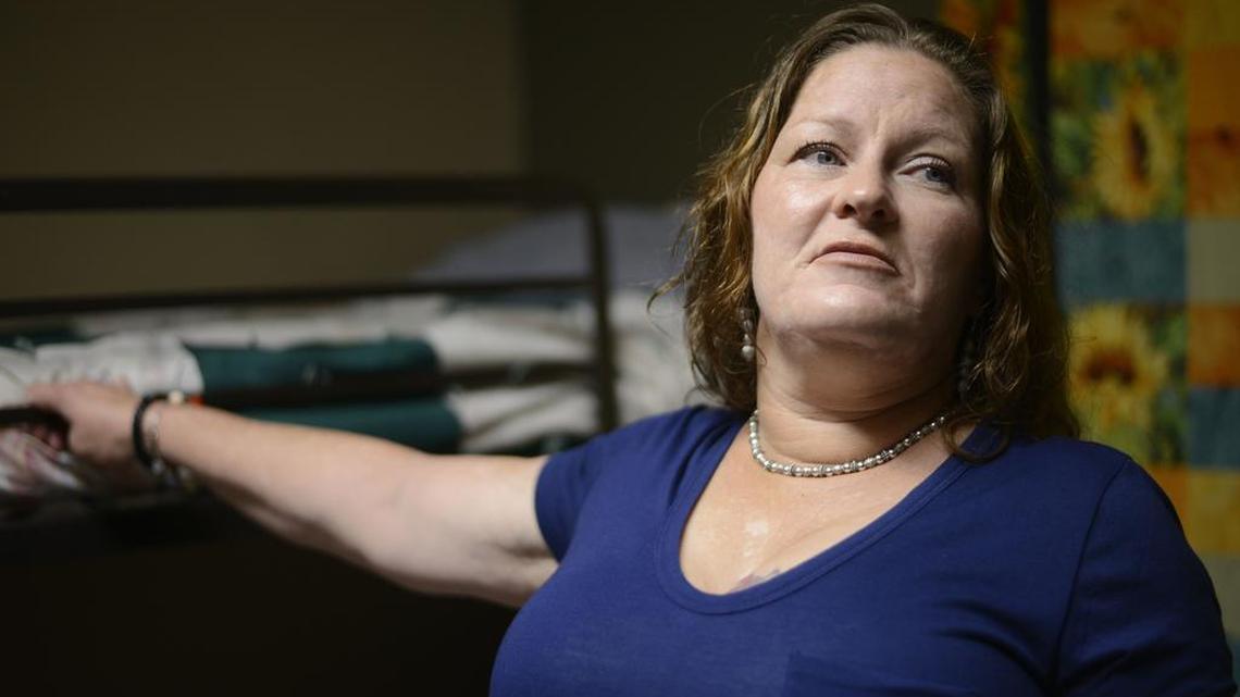 Susan Contreras stands next to her bed in a Phoenix-area shelter for victims of domestic violence on Wednesday, Aug. 3, 2016. Contreras is part of a unique program at the Barrow Neurological Institute in Phoenix that aims to assist abuse survivors who have suffered head trauma.