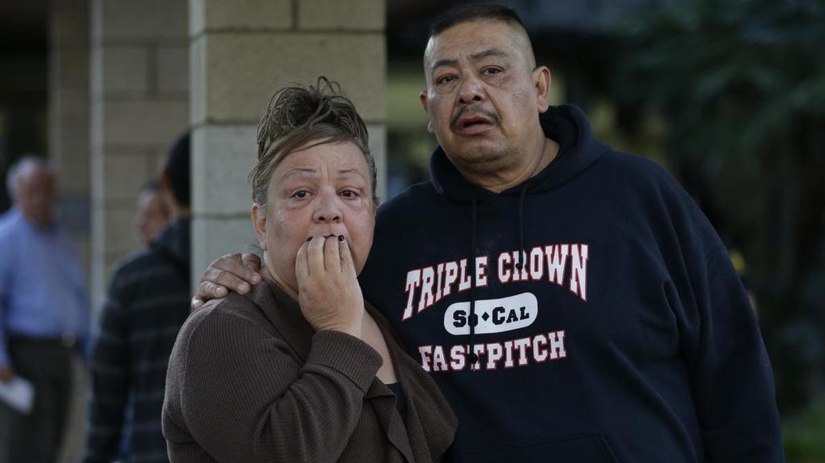 People wait at a community center for a family member who was near a shooting that killed multiple people at a social services center, Wednesday, Dec. 2, 2015, in San Bernardino, Calif.