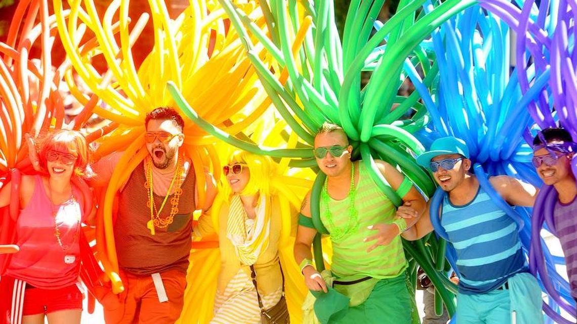 Revelers with balloons create a human rainbow during San Francisco's 42nd annual Gay Pride Parade on Sunday, June 24, 2012. The sidewalks of downtown San Francisco were crowded with colorful revelers on Sunday as the city marked its 42nd year celebrating the lesbian, gay and transgender community.