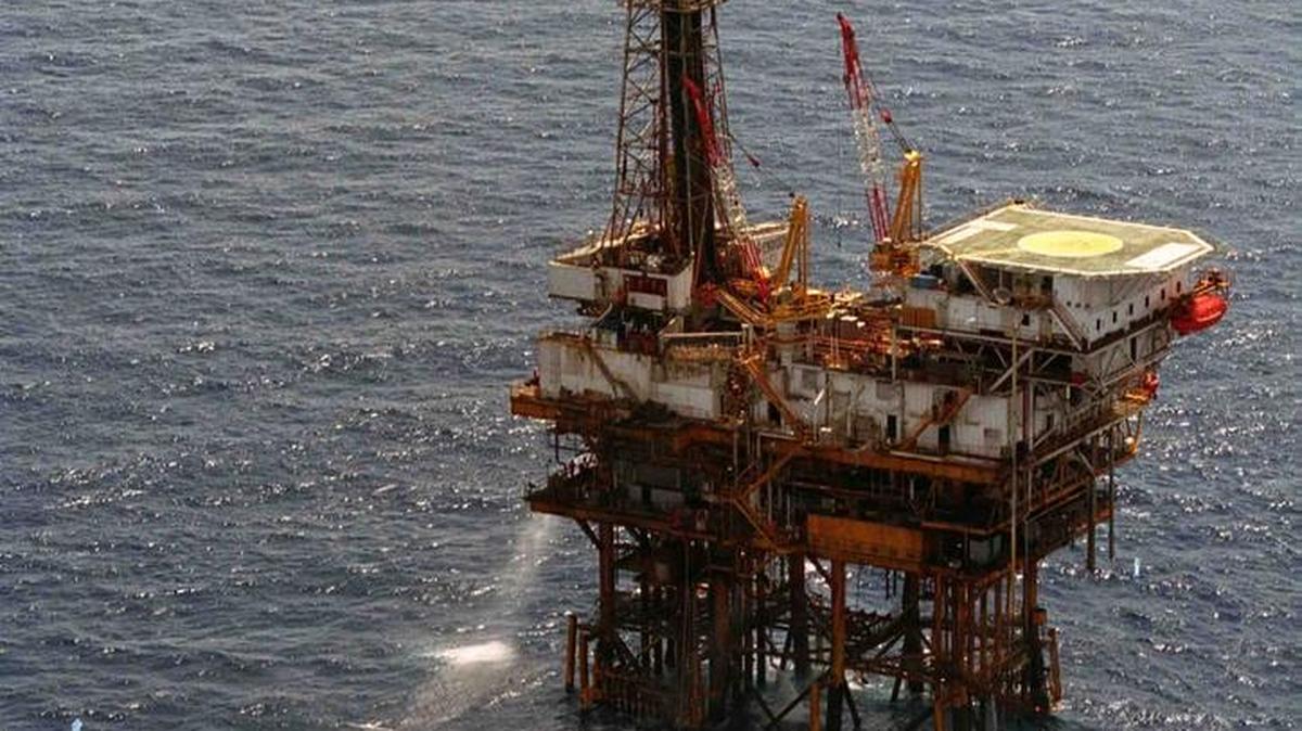 In this undated photo a boat nears an offshore oil rig in the Gulf of Mexico. Gulf oil production is slated to increase this year and next despite a slowdown in new production and exploration due to low oil prices.