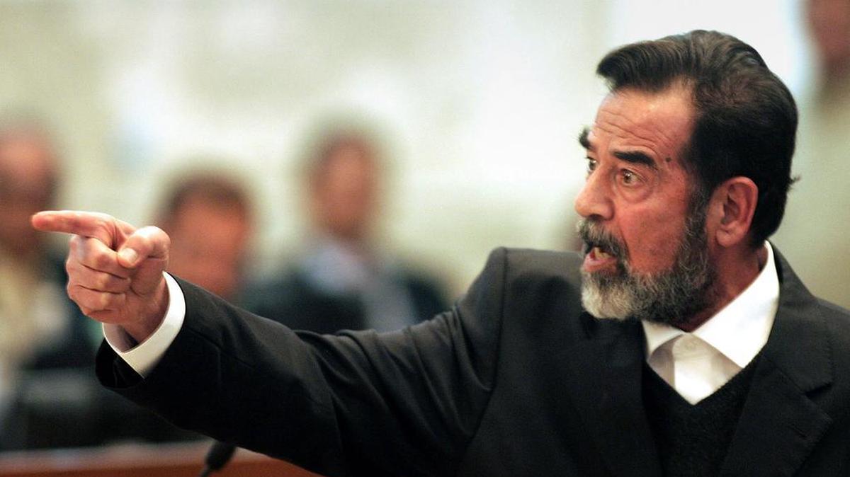 Former Iraqi president Saddam Hussein gestures during his trial in Baghdad, in this Jan. 29, 2006 file photo.