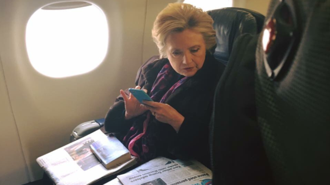 A fellow passenger captured this photograph of former Democratic presidential nominee Hillary Clinton on a flight Friday.