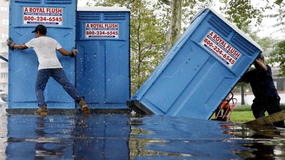 Woman runs from police, hides inside portable toilet