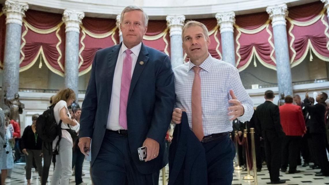 Rep. Mark Meadows, R-N.C., chairman of the conservative House Freedom Caucus, and Rep. Jim Jordan, R-Ohio, a key member of the group, walk through Statuary Hall at the Capitol in Washington, Wednesday.
