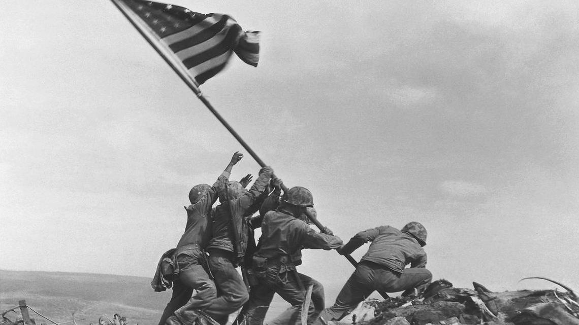 US Marines of the 28th Regiment, 5th Division, raise the American flag atop Mt. Suribachi, Iwo Jima, Japan, on Feb. 23, 1945. The Marines Corps announced Thursday, June 23, 2016, that one of the six men long identified in the iconic World War II photograph is actually not in the image. A panel found that Private First Class Harold Schultz, of Detroit, is in the photo and that Navy Pharmacist’s Mate 2nd Class John Bradley isn’t. Bradley had participated in an earlier flag-raising on Mount Suribachi.